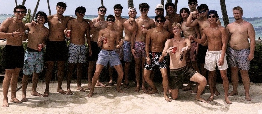 A fraternity chapter gathered on the beach