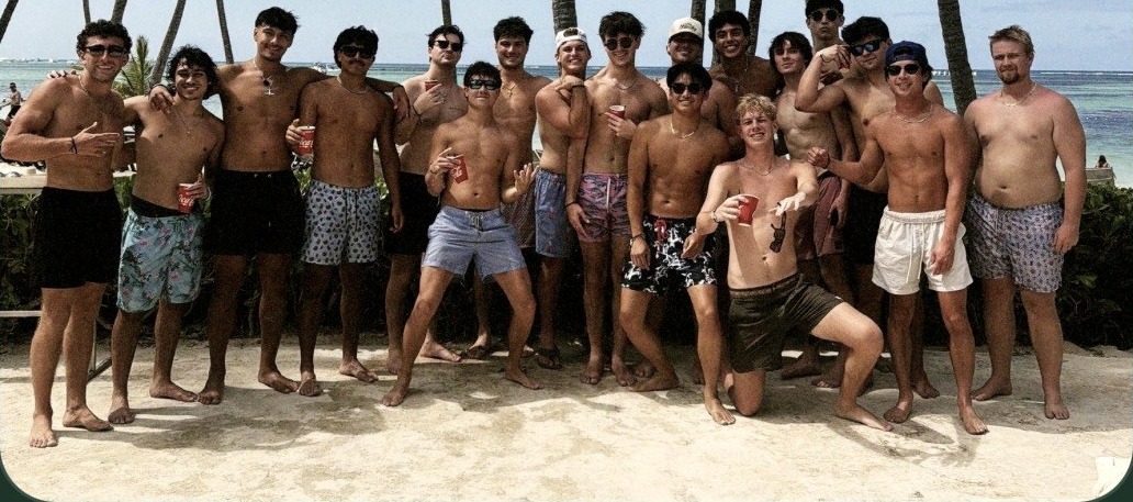 A fraternity chapter gathered on the beach